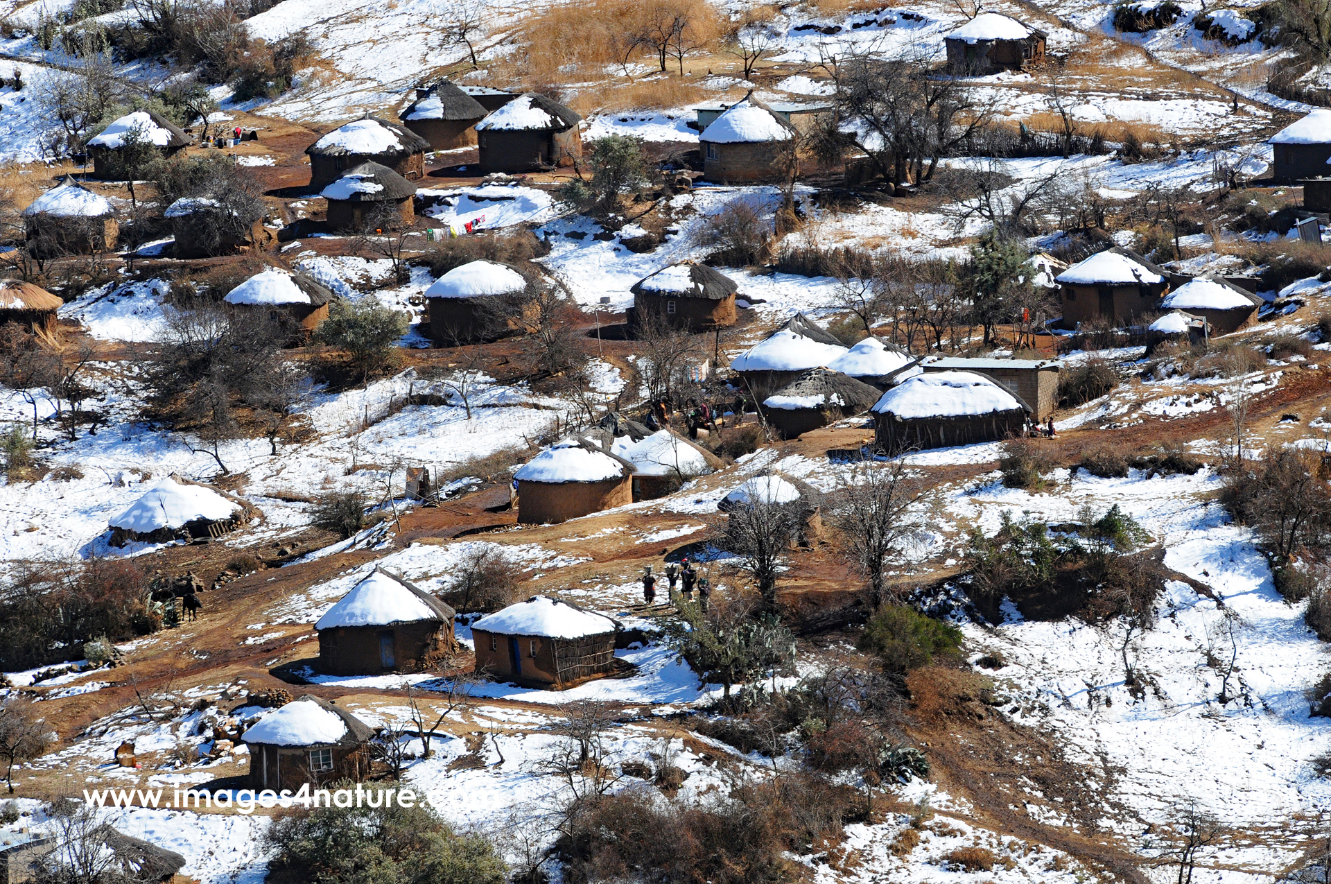View of a village with typical round stone houses in the remote rural Lesotho highlands in winter