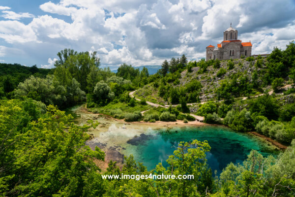 Orthodox church overlooking the turquoise colored Cetina river spring