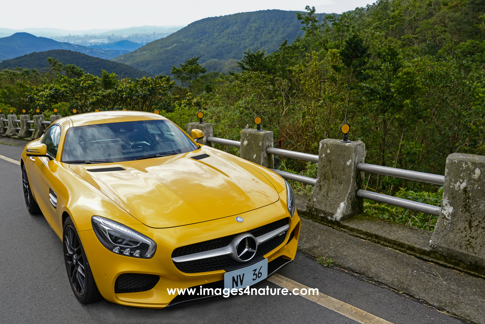Right front view of Mercedes AMG GT Coupe on mountain road