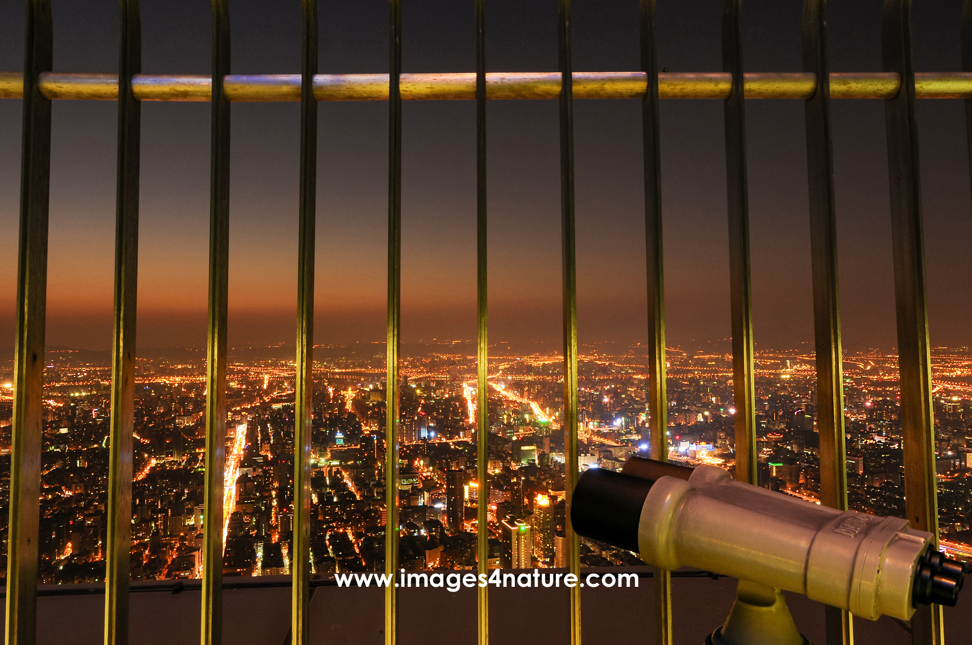 Night city view with binoculars from Taipei 101