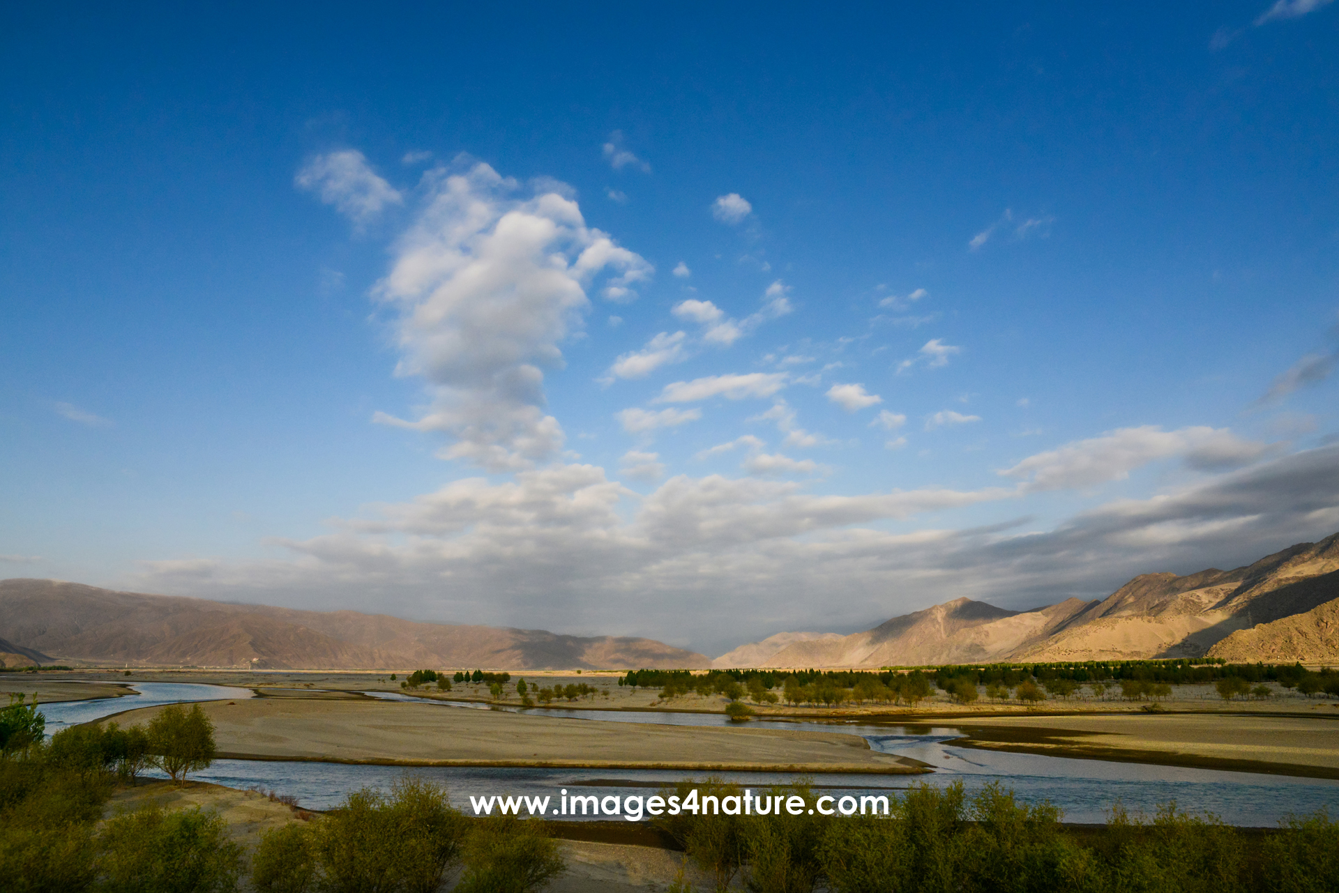 Early morning view of the river banks of Tibet's Yarlung Zangbo river in mountain valley