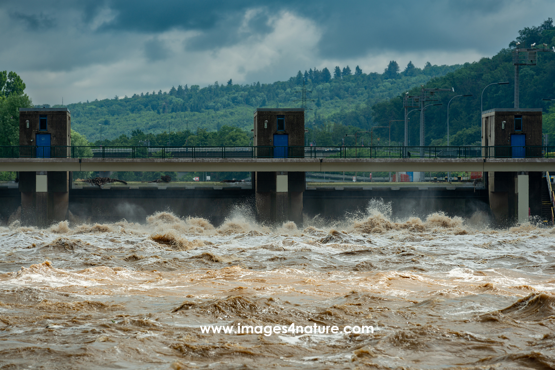 Close-up on the Neckar weir and lock at Esslingen during high water with strong waves and currents